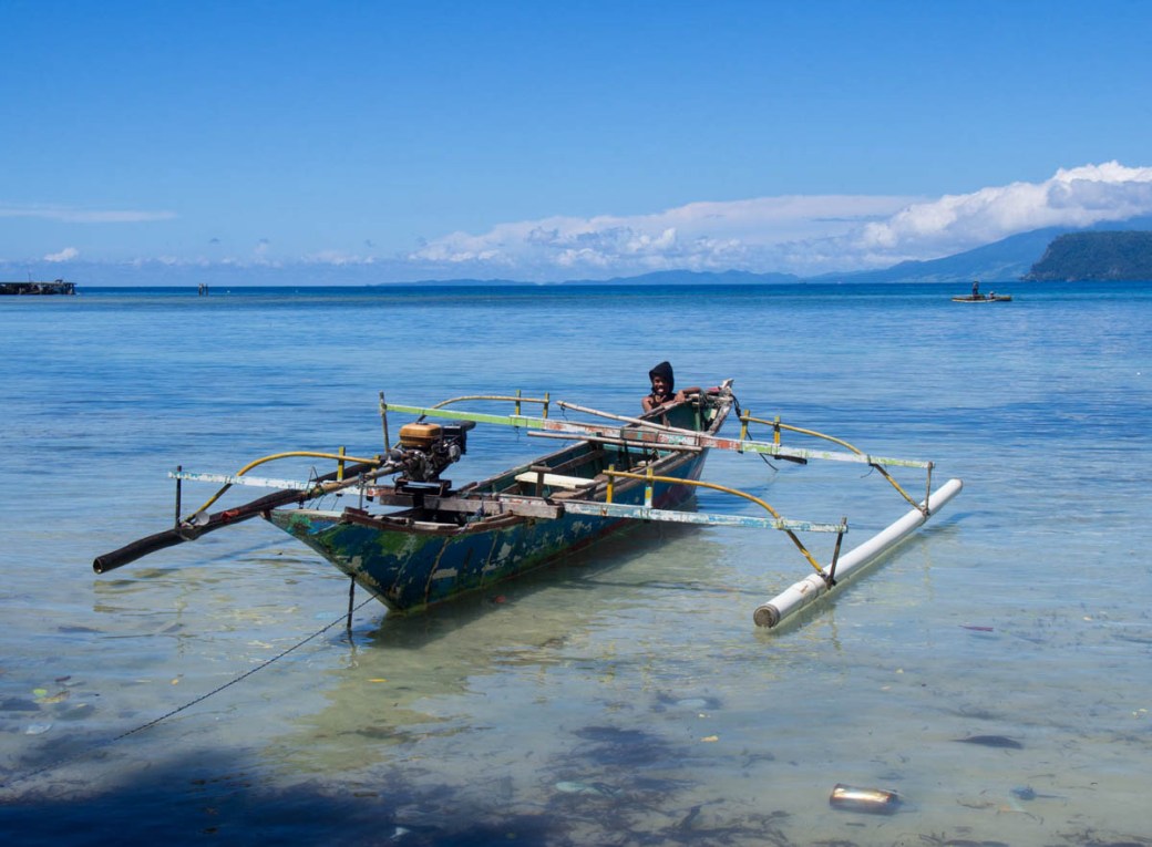Boy with traditional boat